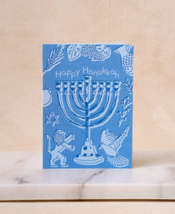 Happy Hanukkah greeting card with menorah design